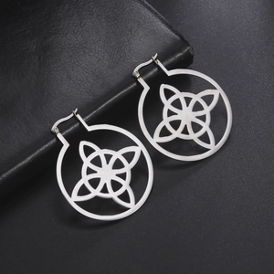 Polished 304 stainless steel hoop earrings with celtic knot design on black background