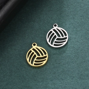 Detailed view of hollow volleyball pendants in gold and silver for jewelry making