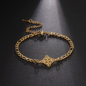 Detailed view of golden Figaro chain bracelet featuring an intricate Celtic knot pendant