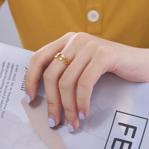 Gothic hollow heart skull ring in gold stainless steel shown on model's hand