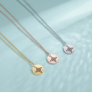 Three minimalist stainless steel S-shape necklaces in gold, rose gold and silver