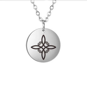 Minimalist stainless steel necklace featuring a round Celtic knot pendant on white background