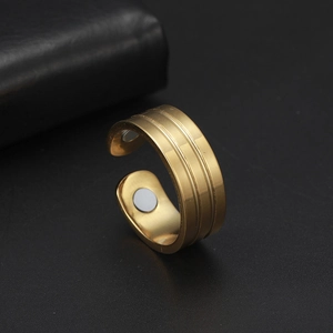 Detailed close-up of matte gold health ring featuring inner therapeutic magnets