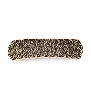 Vintage bronze alloy hair clip with Celtic knot pattern on a clean white background