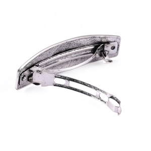 Vintage silver alloy spring hair clip with distressed texture and retro pattern design