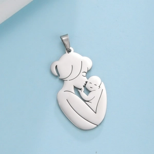 Polished stainless steel mother and child silhouette pendant on a blue background
