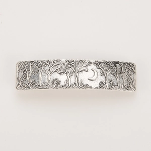 Detailed relief of moon and forest on vintage silver metal spring hair clip accessory