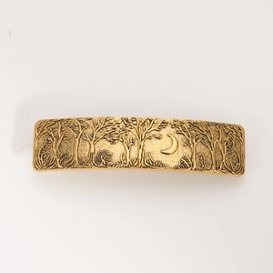 Detailed relief of forest and crescent moon on vintage gold alloy hair clip