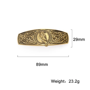 Vintage bronze Viking eagle hair clip with Celtic knot patterns on a white background