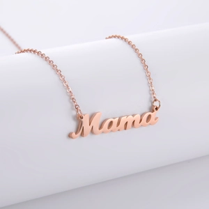 Detailed close-up of rose gold Mama pendant necklace with 18K gold plated finish