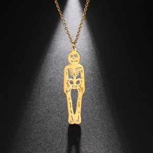 Pendentif squelette doré poli avec structure osseuse complète sur fond noir texturé