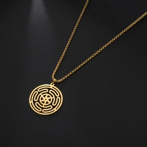 Golden Hecate wheel pendant on stainless steel chain over dark textured background
