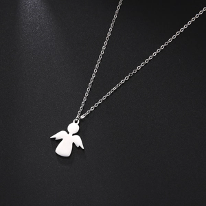 Macro detail of silver angel pendant on thin chain over a dark textured surface