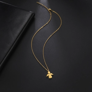 Detailed view of gold angel pendant necklace with lobster clasp on black background