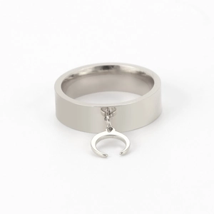 Detailed view of silver minimalist ring with polished finish and dangling crescent moon charm