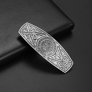 Close-up of vintage silver hair clip with Norse runes and Viking Vegvisir compass detail