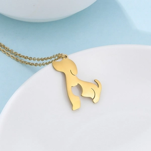 Detail of gold puppy and kitten silhouette pendant on O-chain necklace for pet lovers