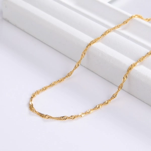 Detailed close-up of 18k gold plated wave chain necklace showing fine twisted texture