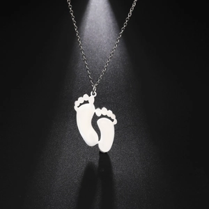 Polished baby footprint pendant necklace in silver stainless steel with a fine chain link