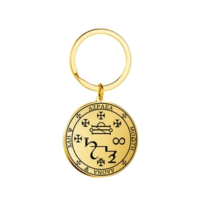 Golden stainless steel magic talisman keychain with circular mystical occult engraving