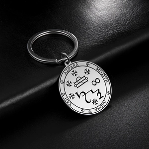 Polished stainless steel keychain with mystical sigil engraving on black leather