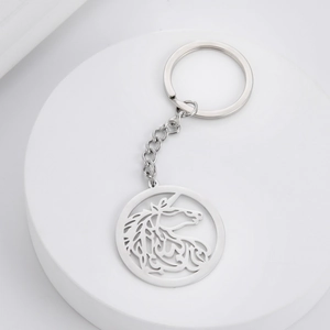 Detailed view of cutout unicorn keychain made from polished stainless steel