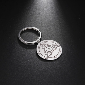 Macro detail of polished stainless steel keychain with Hebrew Solomon seal engravings