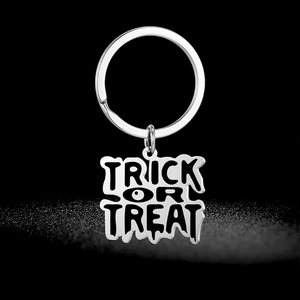 Porte-clés Halloween Trick or Treat en acier inoxydable avec design de lettres gouttes