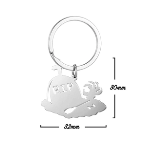 Detailed view of silver stainless steel RIP tombstone keychain with size 30mm x 32mm
