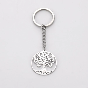 Macro shot of silver stainless steel tree of life pendant keychain with hollow design