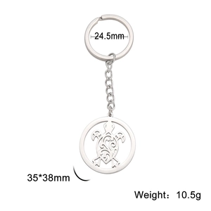 Stainless steel turtle keychain with hollow pattern and size dimensions on white background
