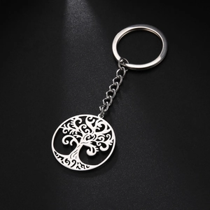 Macro shot of stainless steel Tree of Life keychain with polished silver hollow pendant