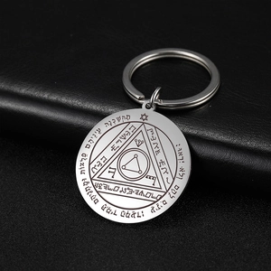 Close-up of engraved tarot sun series keychain in polished silver stainless steel