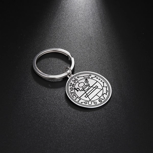 Detailed macro of silver Solomon seal amulet keychain with geometric engraving