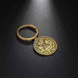 Macro shot of Solomon Seal amulet keychain with intricate geometric engraving in gold finish