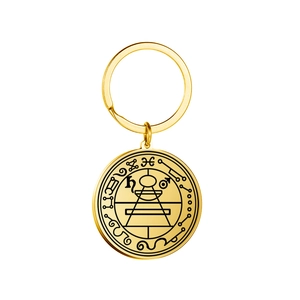 Golden Solomon seal keychain with geometric occult symbols on a round pendant