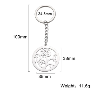 Silver stainless steel keychain featuring a hollow round flower and leaf pattern pendant