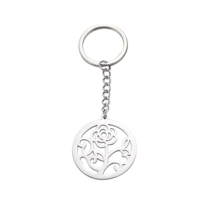 Polished stainless steel keychain with hollow rose and leaf pattern pendant on white background