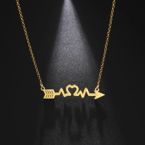 Detail of gold MOM necklace featuring heart arrow and heartbeat pendant on O-chain