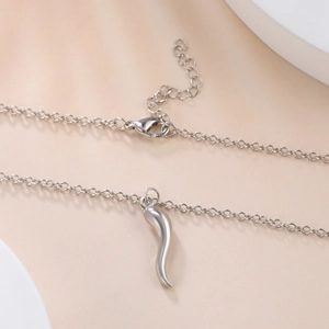 Detail shot of a silver Italian Corno horn pendant with lobster clasp and extension chain