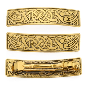 Detailed close-up of retro golden barrette with Celtic knot and bird totem design