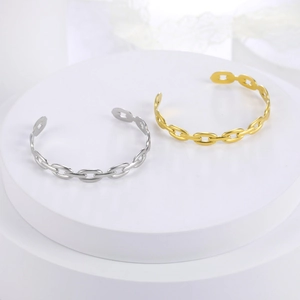 Detail of gold and silver plated stainless steel oval link chain open bracelets set