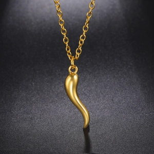 Polished gold chili pepper horn pendant necklace with high-gloss finish on a black background