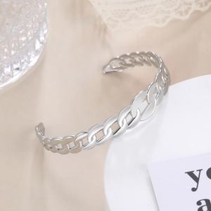 Polished silver Cuban link open bangle in stainless steel for a minimalist look