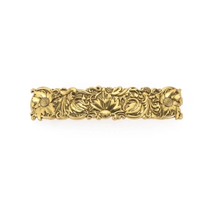 Vintage gold rectangle hair clip with embossed floral sunflower patterns on white background