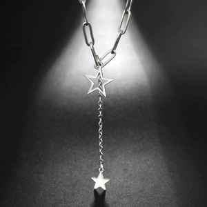 Detail of silver stainless steel Y-shaped necklace with double star pendants