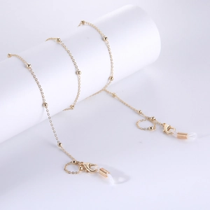 Detailopname van de 18K vergulde brillenketting met kreeftsluitingen en siliconen lussen