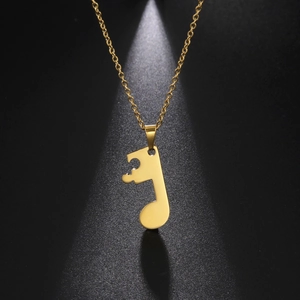 Gold stainless steel necklace with musical note puzzle pendant on a refined cross chain