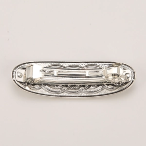 Detailed back view of vintage Celtic knot hair clip with sturdy spring mechanism