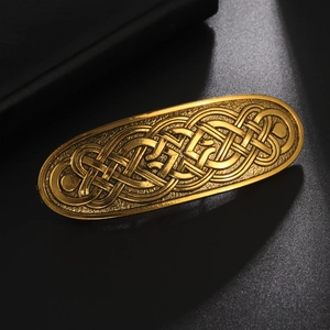 Golden Celtic knot vintage long metal hair clip with detailed weaving pattern on black